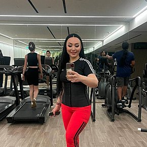 Ferrari escort in Dubai offers Strap on services