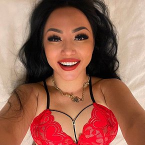 Ferrari escort in Dubai offers Strap on services